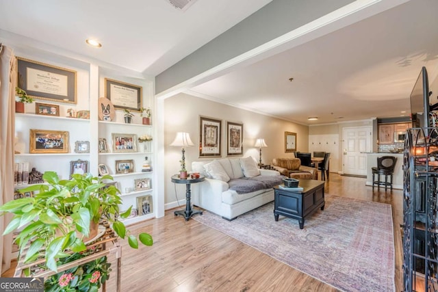3201 Lenox Rd NE Unit 16, Atlanta, GA 30324 - living room featuring recessed lighting, wood finished floors, and crown molding