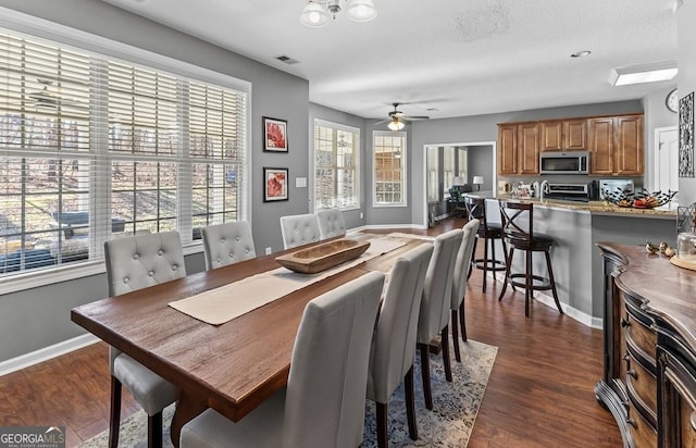 310 Persimmon Dr, Sharpsburg, GA 30277 - dining area with dark wood-style flooring and ceiling fan