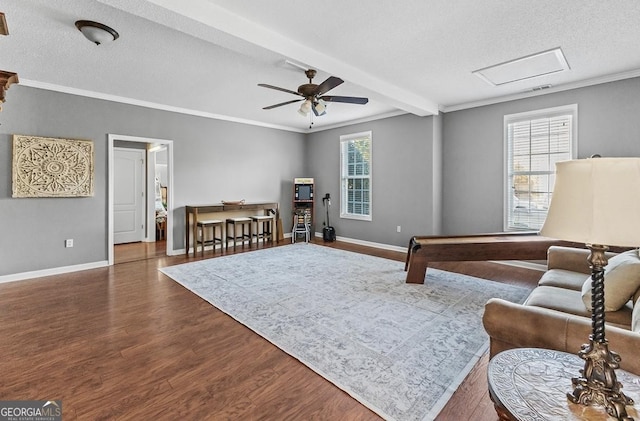 310 Persimmon Dr, Sharpsburg, GA 30277 - living area featuring wood finished floors, a ceiling fan, ornamental molding, a textured ceiling, and attic access