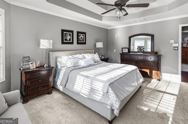 310 Persimmon Dr, Sharpsburg, GA 30277 - bedroom with carpet, crown molding, a tray ceiling, and a ceiling fan