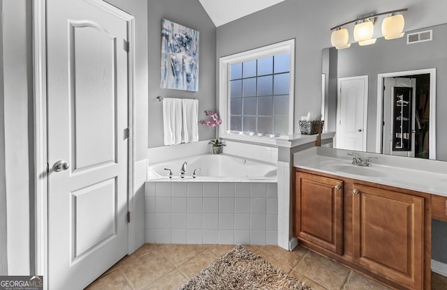 310 Persimmon Dr, Sharpsburg, GA 30277 - full bathroom with a bath, vanity, tile patterned floors, and vaulted ceiling