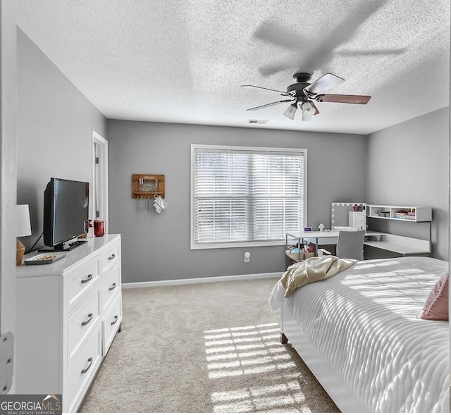 310 Persimmon Dr, Sharpsburg, GA 30277 - bedroom featuring light carpet, ceiling fan, and a textured ceiling