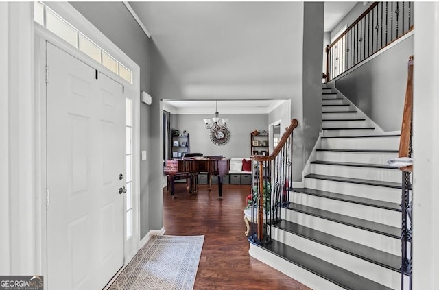 310 Persimmon Dr, Sharpsburg, GA 30277 - entrance foyer featuring crown molding, dark wood finished floors, stairs, and a chandelier