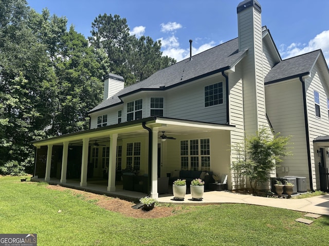 310 Persimmon Dr, Sharpsburg, GA 30277 - back of property with ceiling fan, a patio, a lawn, and a chimney