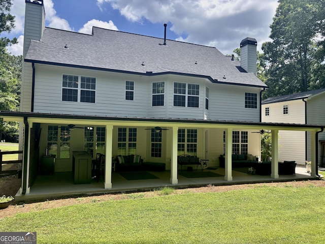 310 Persimmon Dr, Sharpsburg, GA 30277 - rear view of house with ceiling fan, a chimney, a patio area, an outdoor hangout area, and roof with shingles