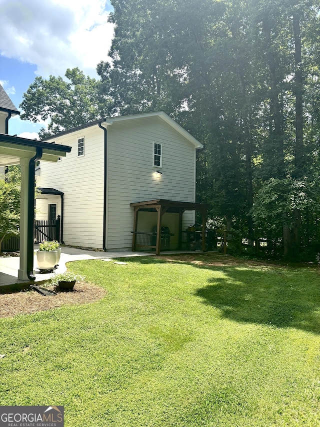 310 Persimmon Dr, Sharpsburg, GA 30277 - view of property exterior with a yard and a patio area