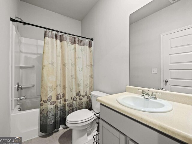 2027 Massey Ln, Winder, GA 30680 - full bath with tile patterned floors, shower / tub combo with curtain, toilet, and vanity