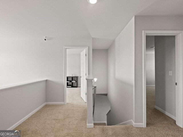 2027 Massey Ln, Winder, GA 30680 - hallway with baseboards, an upstairs landing, and carpet