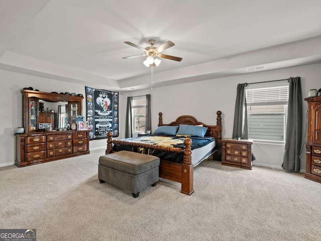 2027 Massey Ln, Winder, GA 30680 - carpeted bedroom featuring baseboards, a raised ceiling, and a ceiling fan