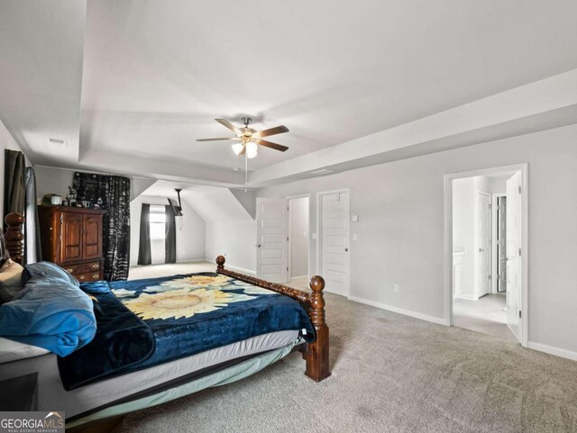 2027 Massey Ln, Winder, GA 30680 - carpeted bedroom with a tray ceiling, baseboards, and ceiling fan