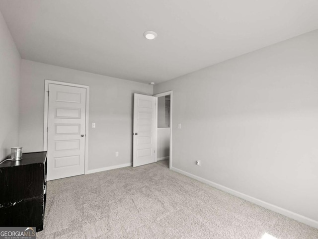 2027 Massey Ln, Winder, GA 30680 - unfurnished bedroom with carpet flooring and baseboards