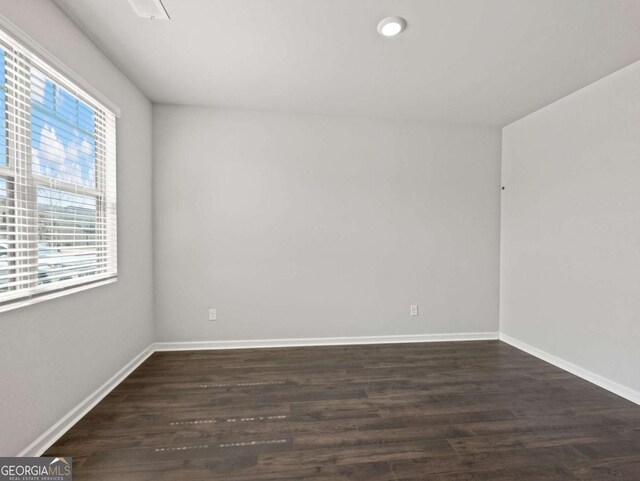 2027 Massey Ln, Winder, GA 30680 - spare room featuring baseboards and dark wood-style floors