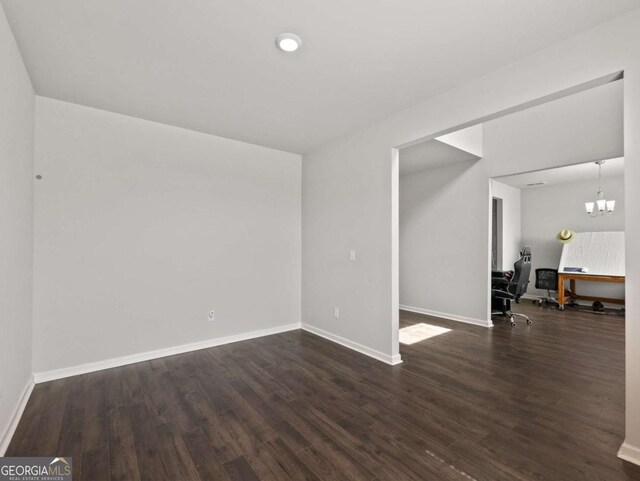 2027 Massey Ln, Winder, GA 30680 - unfurnished living room with dark wood-type flooring and baseboards
