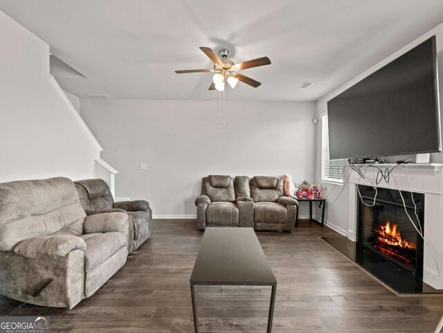 2027 Massey Ln, Winder, GA 30680 - living room with visible vents, a ceiling fan, dark wood-style floors, a premium fireplace, and baseboards