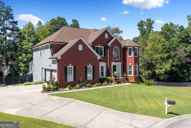 3015 Gold Creek Dr, Villa Rica, GA 30180 - colonial inspired home featuring driveway, brick siding, and an attached garage