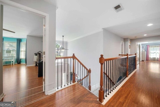 3015 Gold Creek Dr, Villa Rica, GA 30180 - hall featuring an upstairs landing, wood finished floors, recessed lighting, and ornamental molding