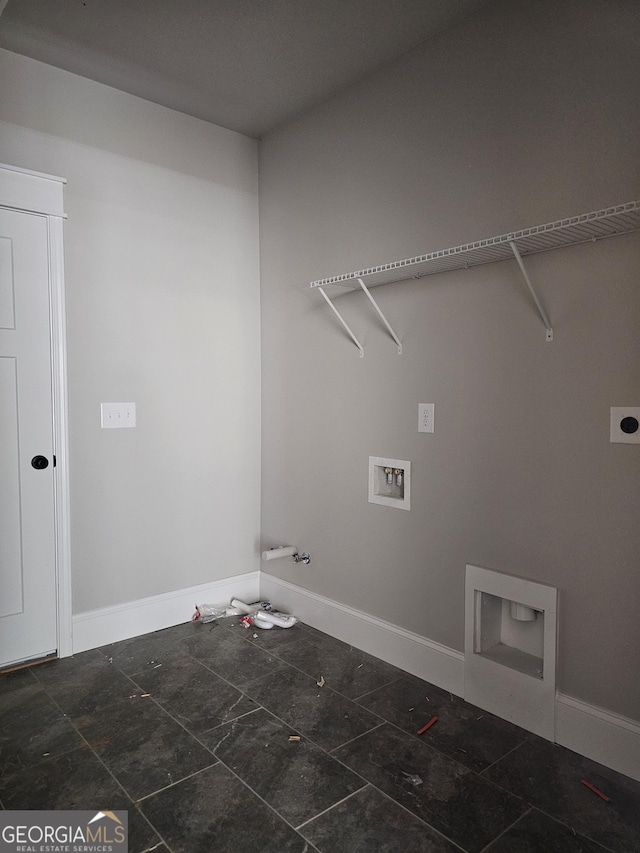 6841 Phillips Mill Rd, Douglasville, GA 30135 - laundry room featuring hookup for a gas dryer, washer hookup, baseboards, and hookup for an electric dryer