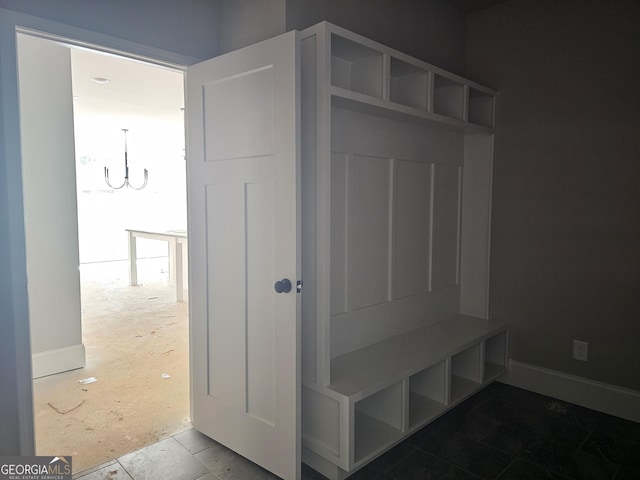 6841 Phillips Mill Rd, Douglasville, GA 30135 - mudroom featuring a chandelier and baseboards