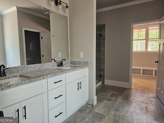 6841 Phillips Mill Rd, Douglasville, GA 30135 - bathroom with crown molding, baseboards, a shower stall, and double vanity