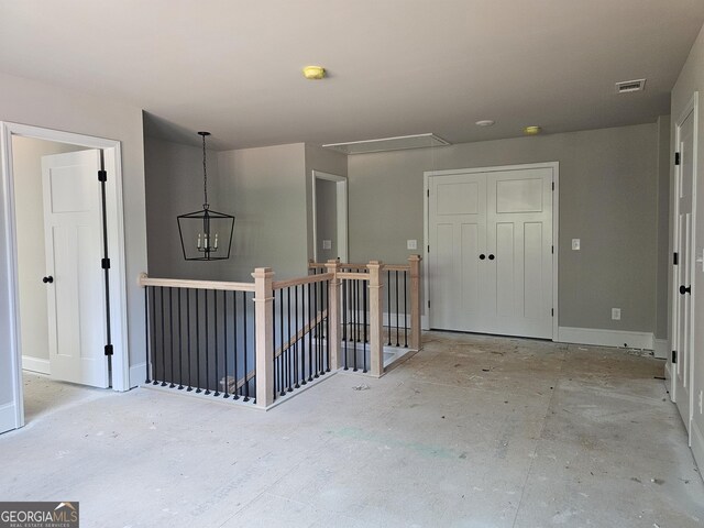 6841 Phillips Mill Rd, Douglasville, GA 30135 - hallway featuring attic access, an upstairs landing, and baseboards