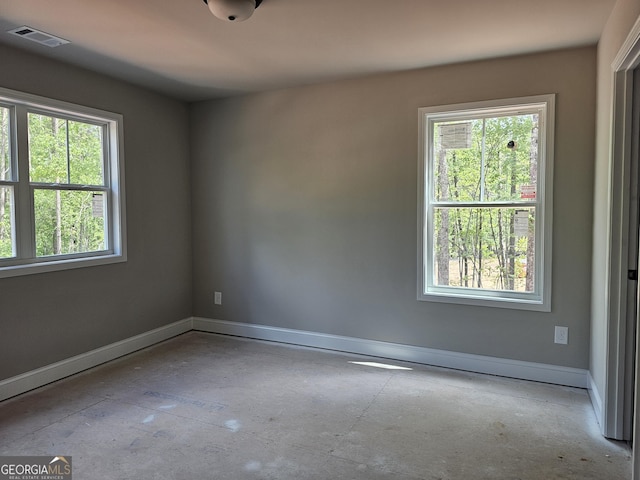 6841 Phillips Mill Rd, Douglasville, GA 30135 - empty room featuring healthy amount of natural light and baseboards