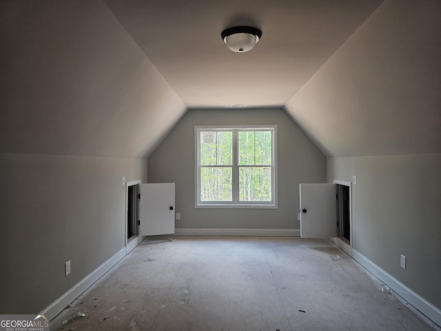 6841 Phillips Mill Rd, Douglasville, GA 30135 - additional living space featuring lofted ceiling and baseboards
