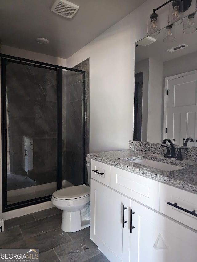 6841 Phillips Mill Rd, Douglasville, GA 30135 - full bathroom featuring a shower stall, toilet, and vanity