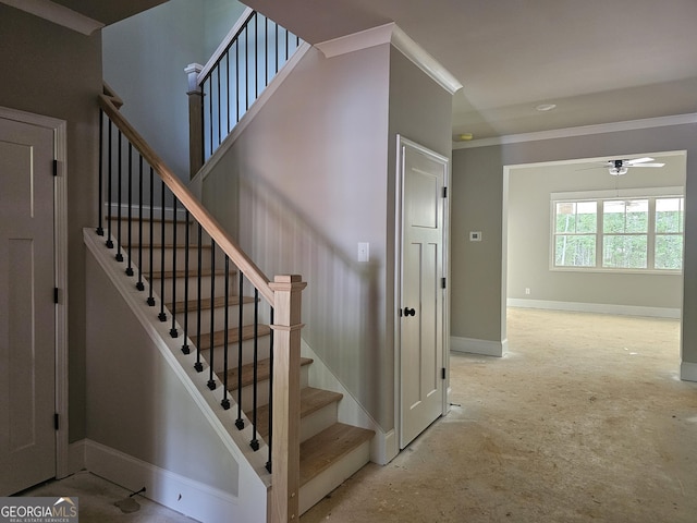 6841 Phillips Mill Rd, Douglasville, GA 30135 - stairway featuring ceiling fan, baseboards, concrete floors, and crown molding