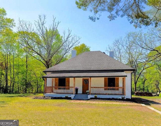 6592 Factory Shoals Rd SW, Mableton, GA 30126 - view of front of home with a porch, a chimney, a front lawn, and a shingled roof