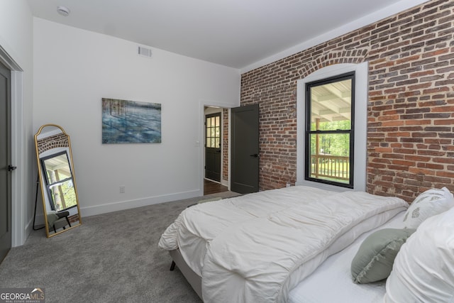 6592 Factory Shoals Rd SW, Mableton, GA 30126 - bedroom featuring brick wall, multiple windows, carpet flooring, and baseboards