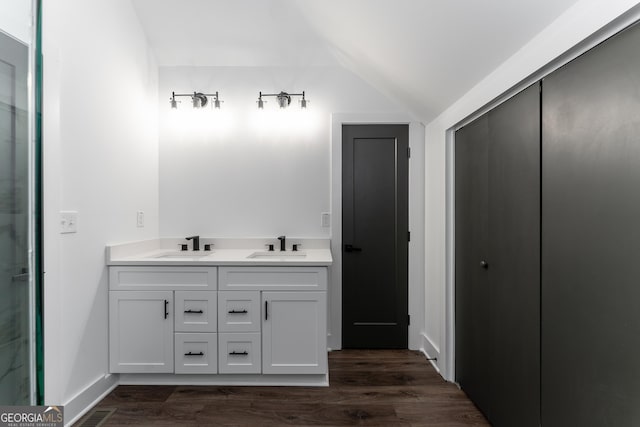6592 Factory Shoals Rd SW, Mableton, GA 30126 - full bath featuring lofted ceiling, double vanity, and wood finished floors
