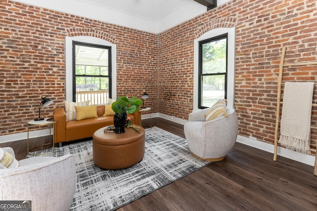 6592 Factory Shoals Rd SW, Mableton, GA 30126 - living area featuring baseboards, plenty of natural light, wood finished floors, and brick wall
