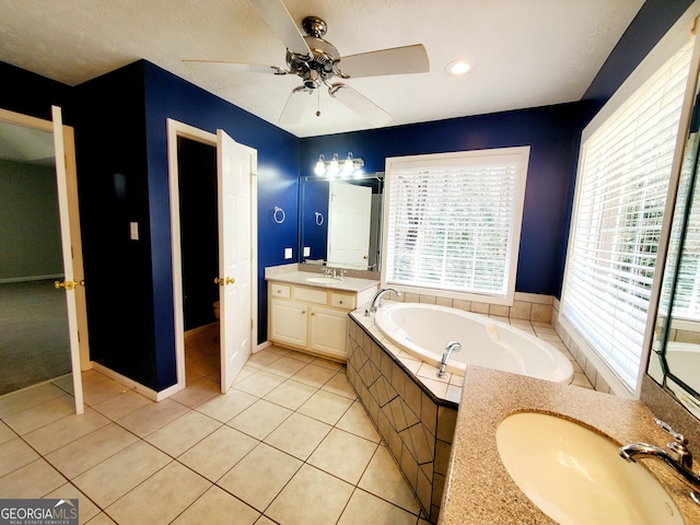full bathroom with a bath, a ceiling fan, a sink, and tile patterned floors