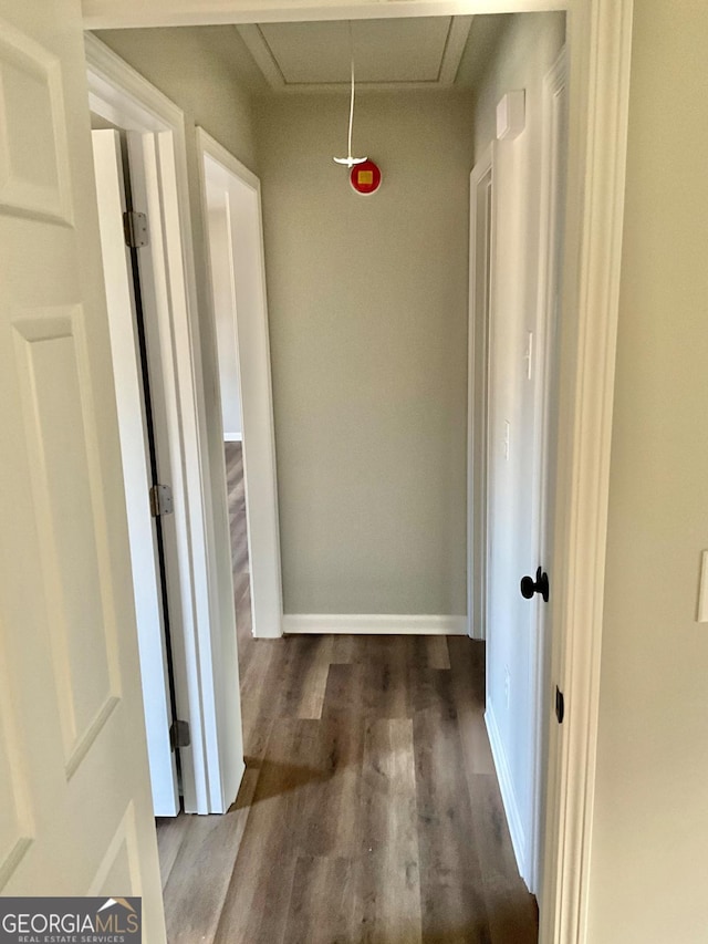 1350 Dogwood Rd, Woodville, GA 30669 - hallway with baseboards, attic access, and wood finished floors