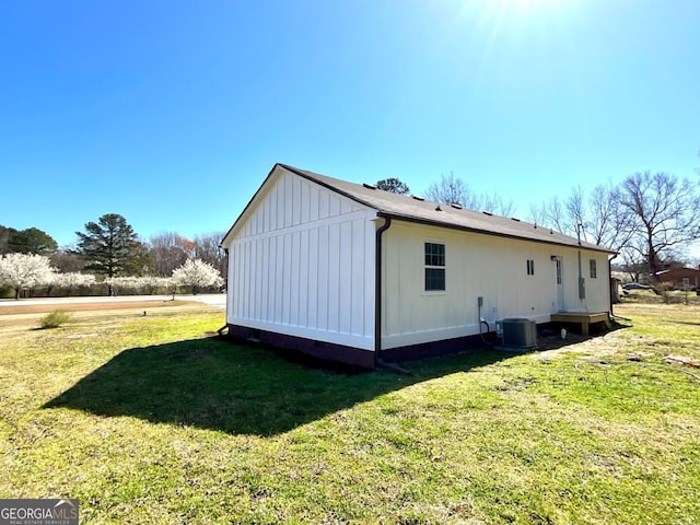 1350 Dogwood Rd, Woodville, GA 30669 - view of side of property featuring cooling unit, board and batten siding, and a yard