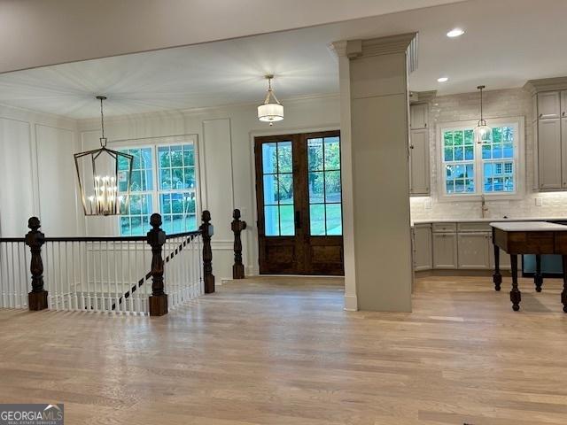 7 Fontaine Dr, Newnan, GA 30263 - foyer featuring light wood finished floors, a chandelier, and recessed lighting
