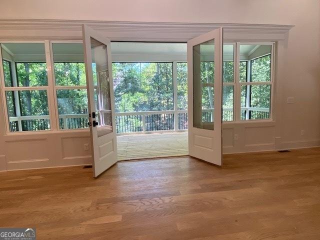7 Fontaine Dr, Newnan, GA 30263 - entryway with wood finished floors, french doors, and healthy amount of natural light