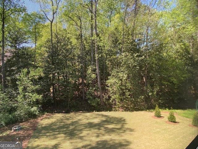 7 Fontaine Dr, Newnan, GA 30263 - view of yard with a wooded view
