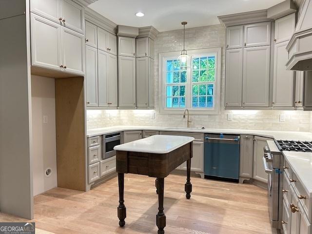 7 Fontaine Dr, Newnan, GA 30263 - kitchen with dishwashing machine, gas stove, a sink, gray cabinets, and light wood-type flooring