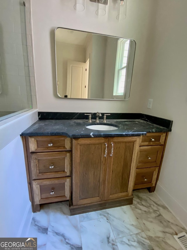 7 Fontaine Dr, Newnan, GA 30263 - bathroom with marble finish flooring, baseboards, and vanity