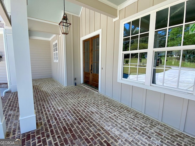 7 Fontaine Dr, Newnan, GA 30263 - doorway to property with board and batten siding, a porch, and french doors