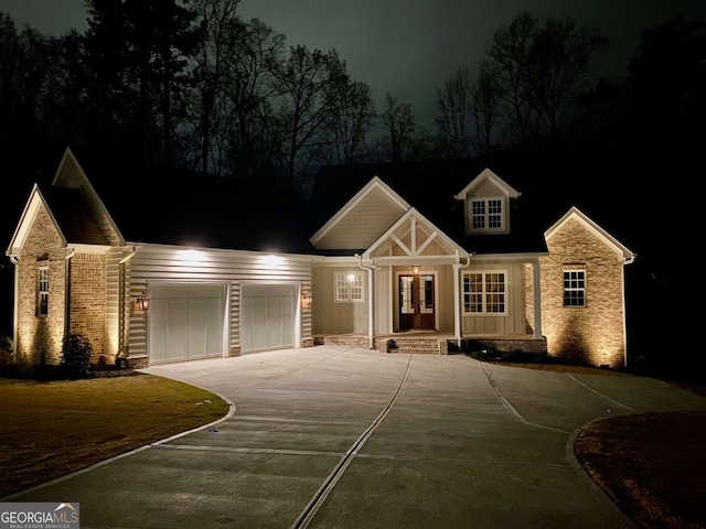 7 Fontaine Dr, Newnan, GA 30263 - view of front of property featuring driveway, a garage, board and batten siding, and covered porch