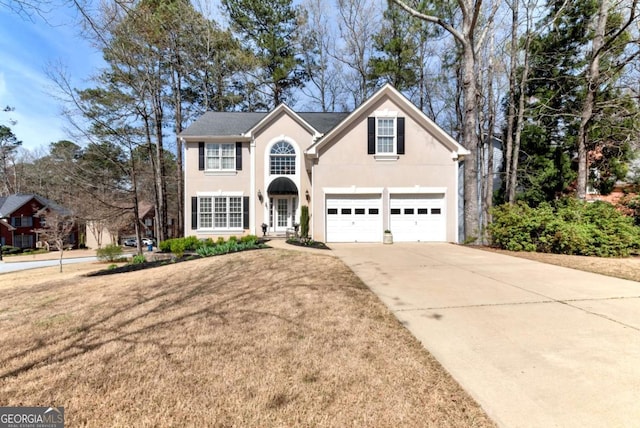 2002 Stonewick Ct, Lawrenceville, GA 30043 - traditional home featuring concrete driveway, stucco siding, a garage, and a front lawn