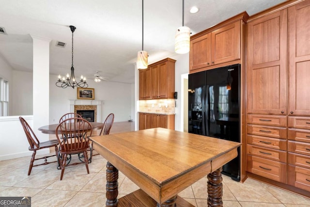 2002 Stonewick Ct, Lawrenceville, GA 30043 - dining space featuring light tile patterned floors, a fireplace, a chandelier, and recessed lighting