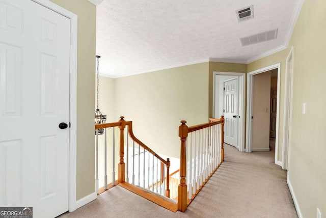 2002 Stonewick Ct, Lawrenceville, GA 30043 - corridor featuring an upstairs landing, carpet, a textured ceiling, and ornamental molding