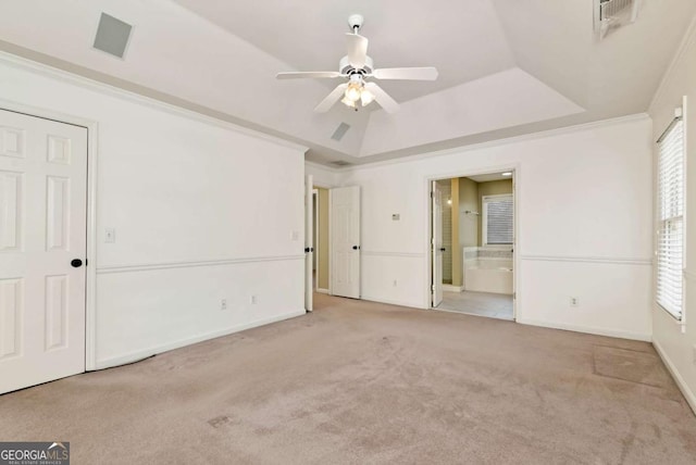 2002 Stonewick Ct, Lawrenceville, GA 30043 - unfurnished bedroom with carpet, a tray ceiling, ensuite bathroom, and multiple windows
