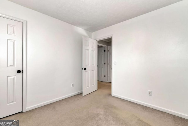 2002 Stonewick Ct, Lawrenceville, GA 30043 - unfurnished bedroom featuring baseboards and carpet floors