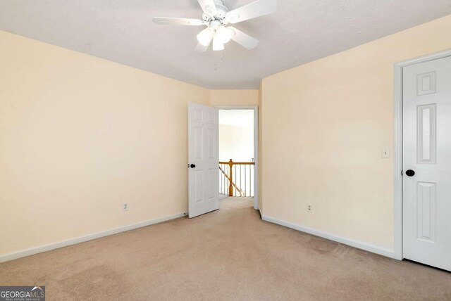 2002 Stonewick Ct, Lawrenceville, GA 30043 - unfurnished bedroom featuring light carpet and ceiling fan