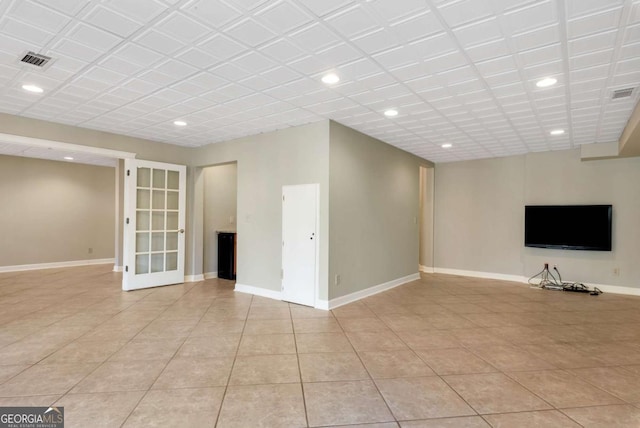 2002 Stonewick Ct, Lawrenceville, GA 30043 - unfurnished living room with recessed lighting, light tile patterned floors, and french doors