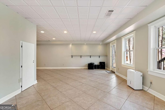 2002 Stonewick Ct, Lawrenceville, GA 30043 - unfurnished room featuring healthy amount of natural light, light tile patterned flooring, and recessed lighting